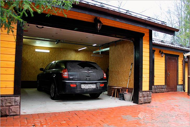 Стены гаража обшиты OSB